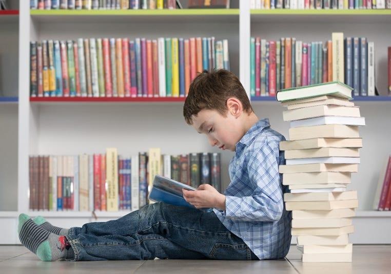 Moderately gifted child sitting in a typical classroom setting representing Level One gifted school experience