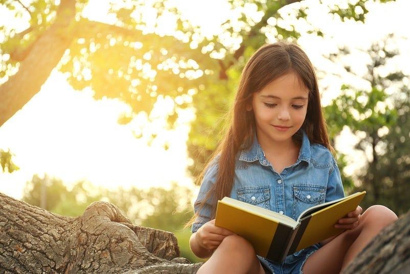 a gifted girl reading a book